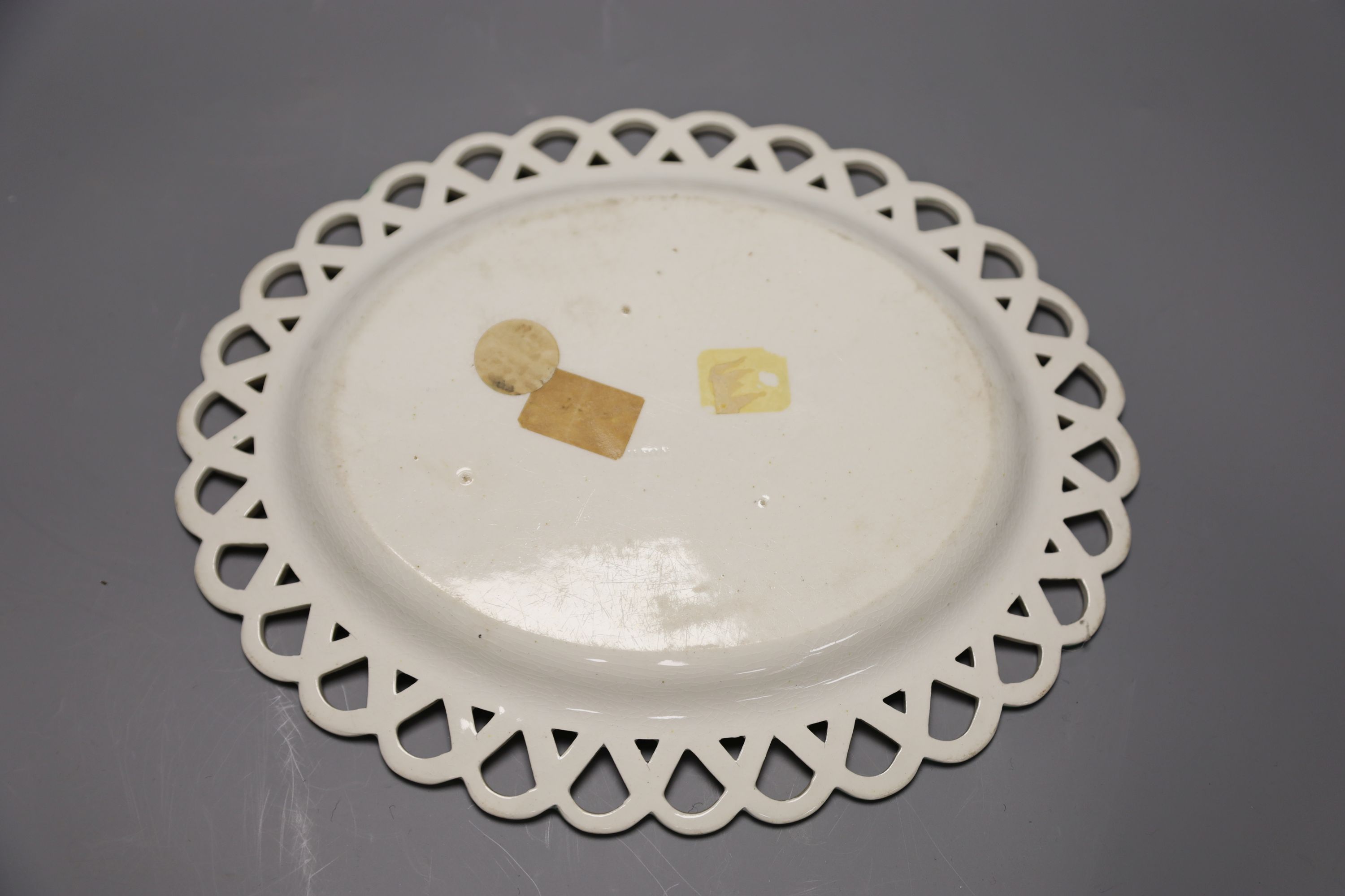 A 19th century creamware sugar bowl and a similar Wilson oval stand, longest 26cm